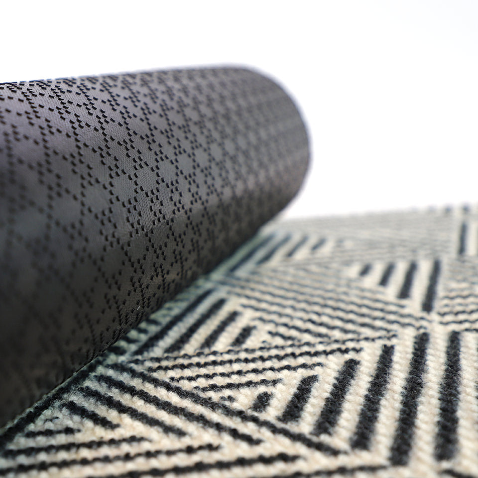 Long lasting doormats like the Escher indoor or outdoor doormat feature a durable rubber backing.