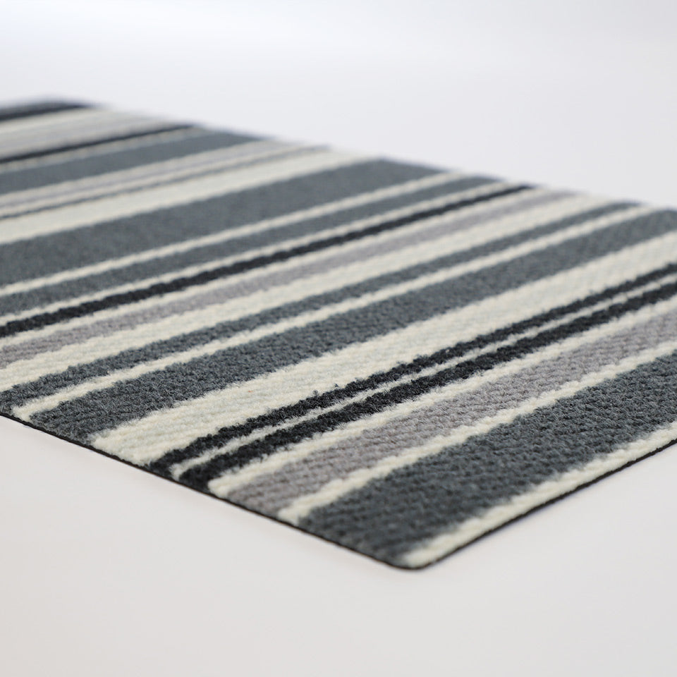 Black white and grey stripes on our low profile non shedding doormat