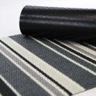 Rubber backing on our grey striped doormat