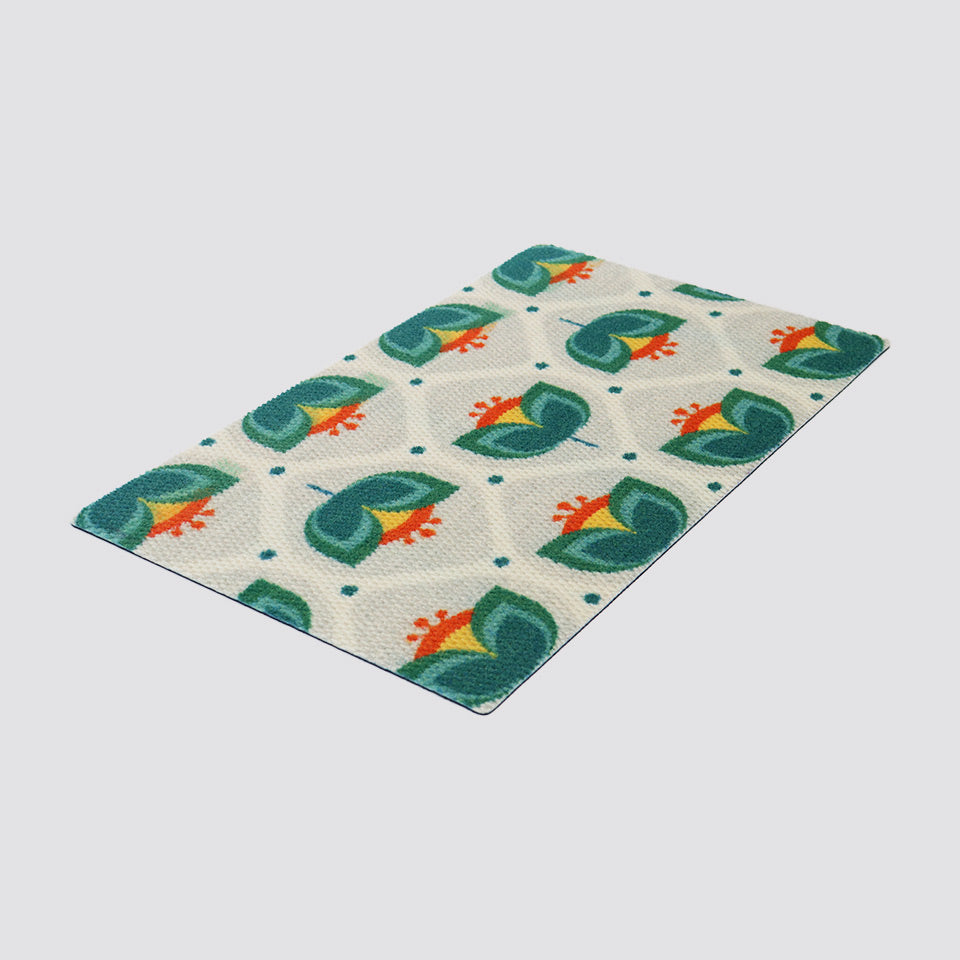 Isolated image of teal and orange floral MCM inspired doormat
