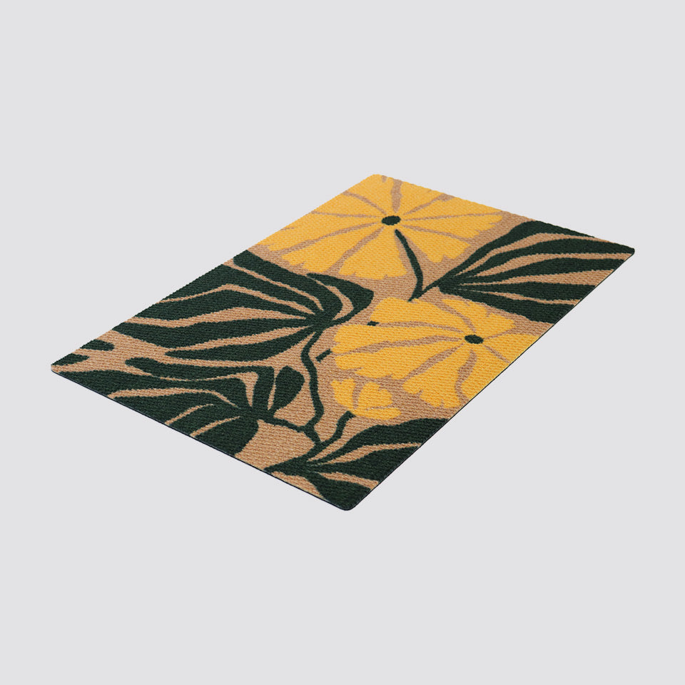Isolated image of yellow and dark green mid century modern inspired botanical patterned doormat