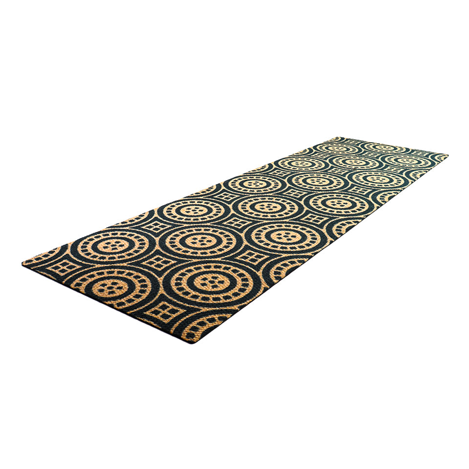 Angled shot of Medallions circular pattern doormat shown in double door size.  Tan doormat with black circles and dots