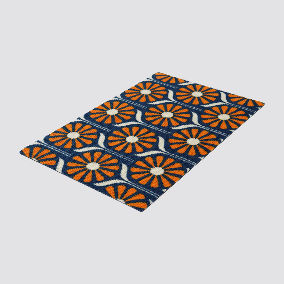Retro Daisies MCM inspired doormat in blue and orange.  The perfect mid century modern vibe on our modern no shed low profile doormats.