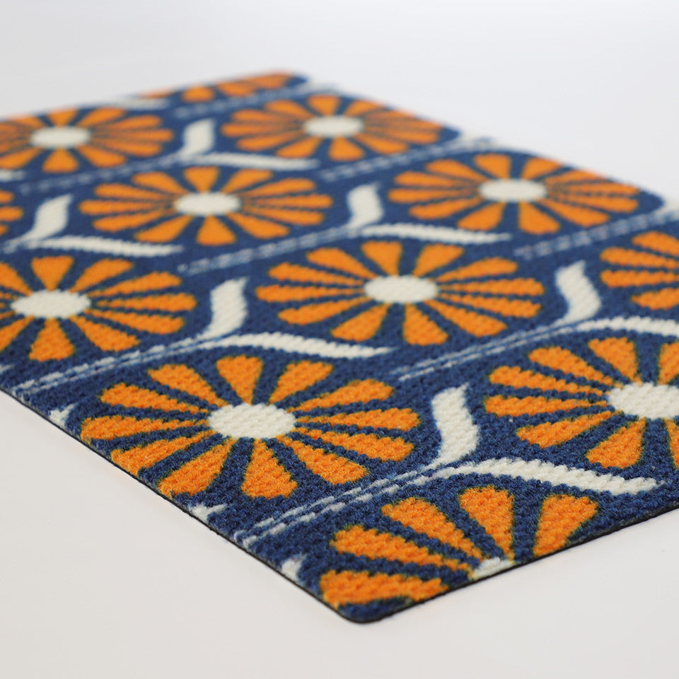 Retro Daisies from our MCM doormat collection.  Shown in retro orange and blue, this floral pattern offers a mid century modern inspired look for your porch or entryway.