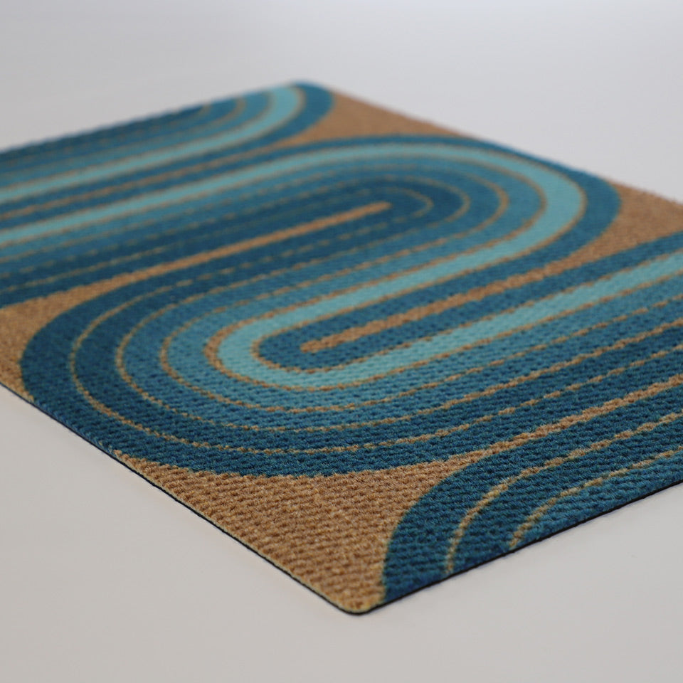 Angled shot of Retro Vibes aqua and coir doormat from our Mid-century modern collection of doormats