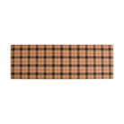 Tattersall plaid in tan, black, and pops of red shown in a double door sized doormat. 