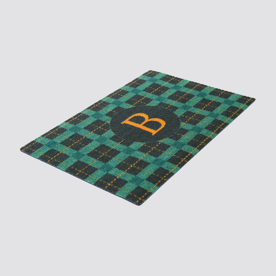 Teal, yellow, and grey monogrammed personalized low profile non shedding doormat in Tattersall plaid.