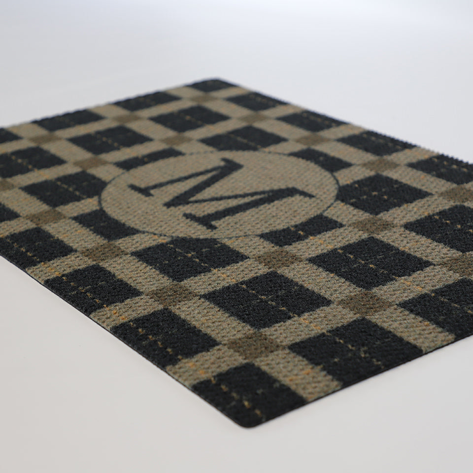 Brown and black plaid non shedding low profile doormat monogrammed with your initial.