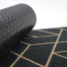 Rubber backing that works well for smooth and carpeted surfaces to help prevent slipping. Rubber back shown on our Triangulation doormat which is a geometric pattern in black and tan.