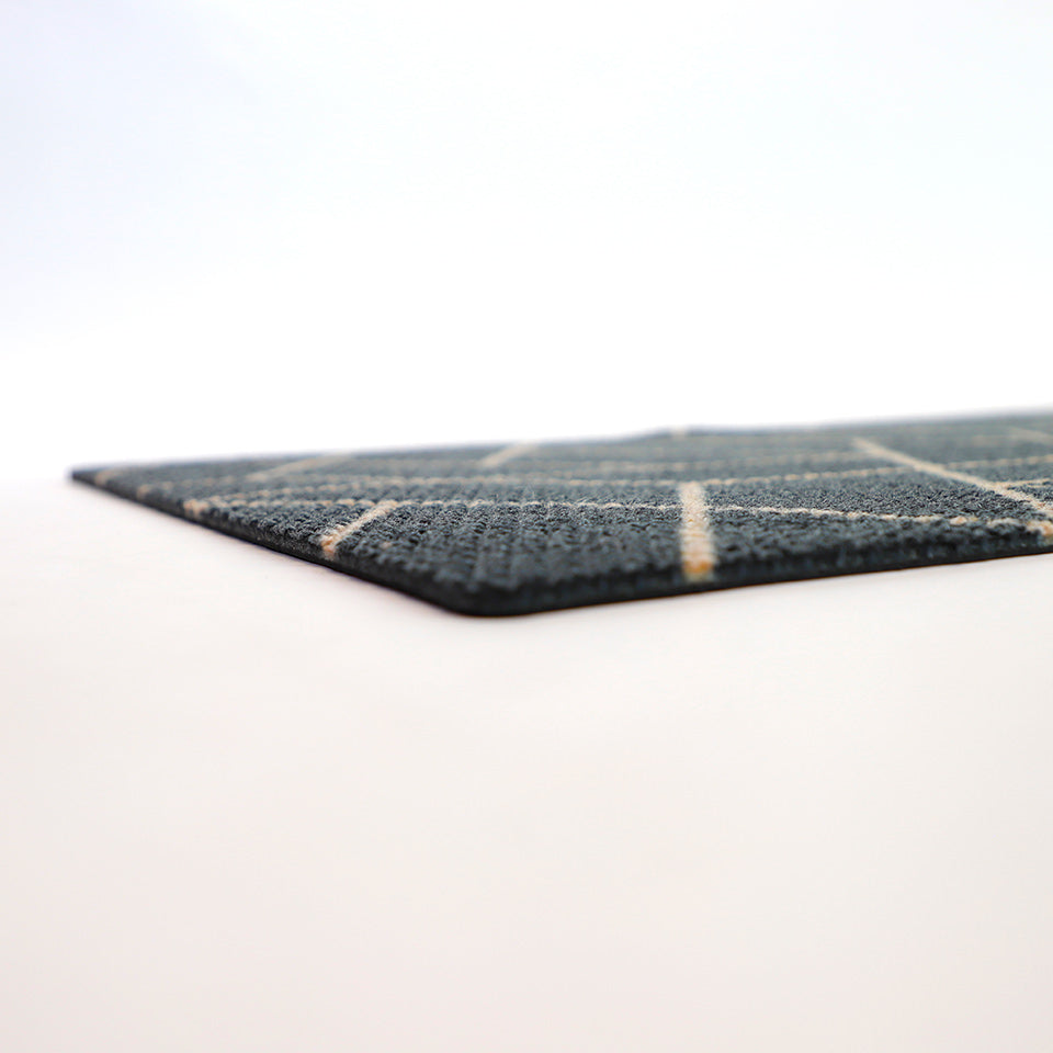 Low profile shot of our Neighburly doormat in triangulation pattern.  A geometric black and coir patterned doormat.