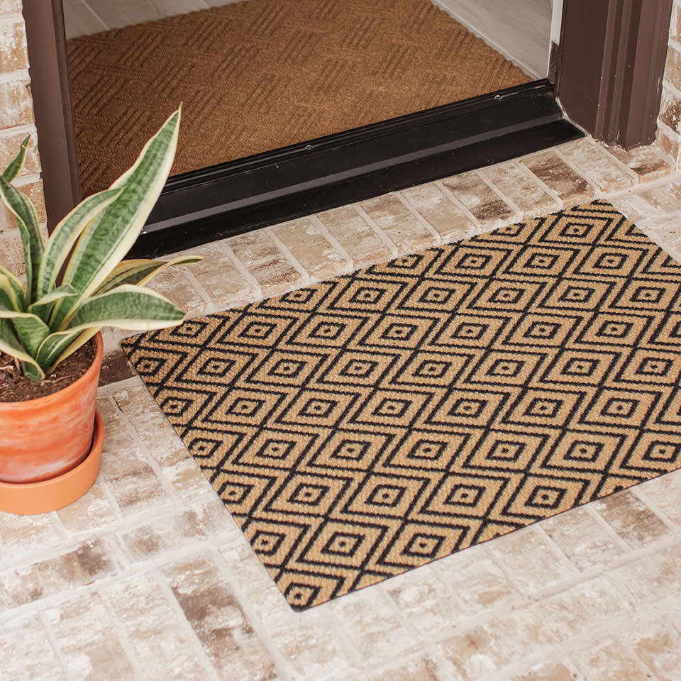 single size coir and black diamond dot doormat in front door entryway paired with Needle & Tread Classic Thatch