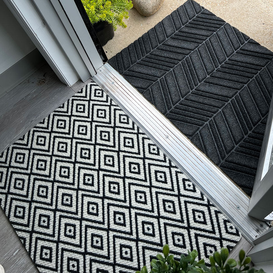 single door size white and black diamond dot doormat inside entryway paired with Needle & Tread In Vein
