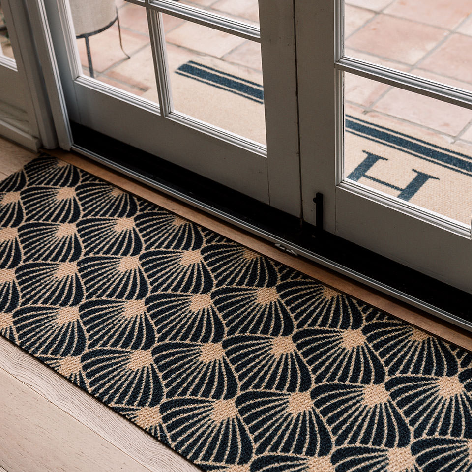 Double door doormat in black and coir floral bloom pattern