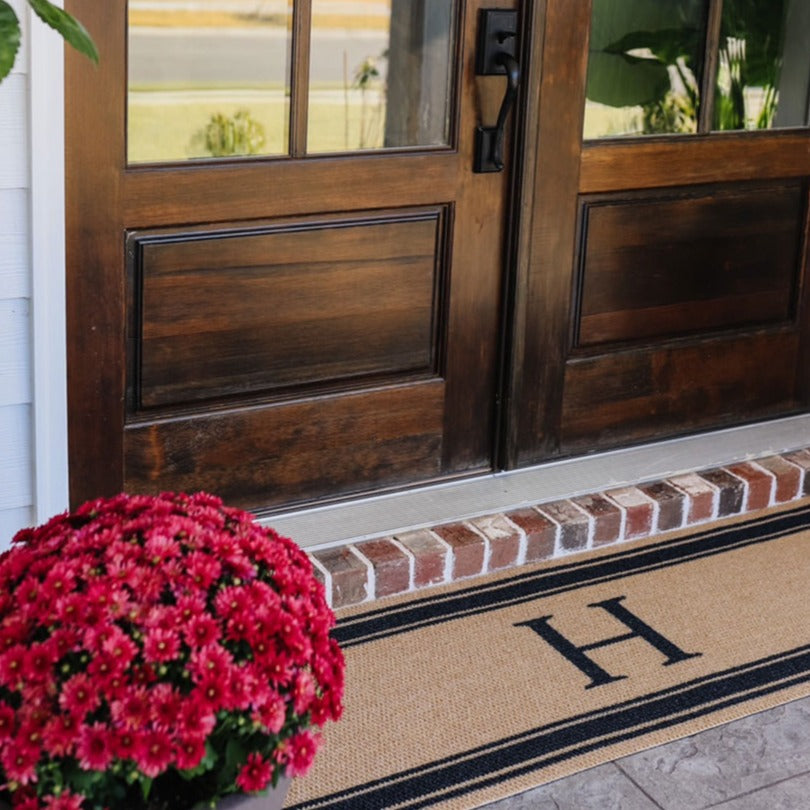 Monogram personalized doormat in coir and black with initial and stripes for double door