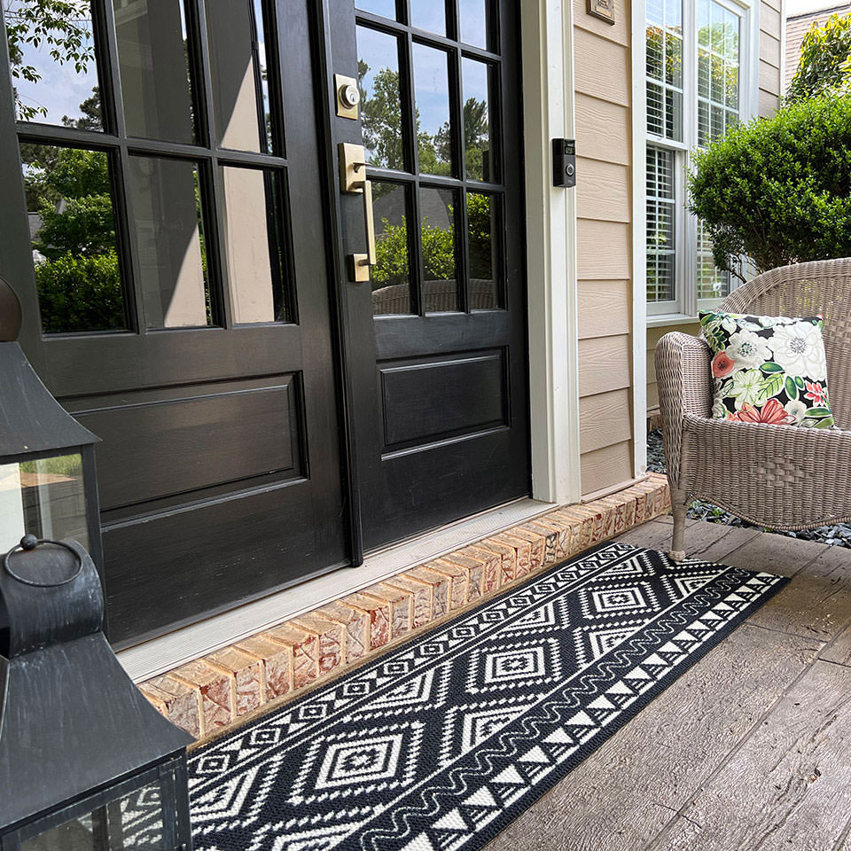 Southwestern double door mat in black and white looks great in front of a set of glass double doors. Made in America with recycled materials.