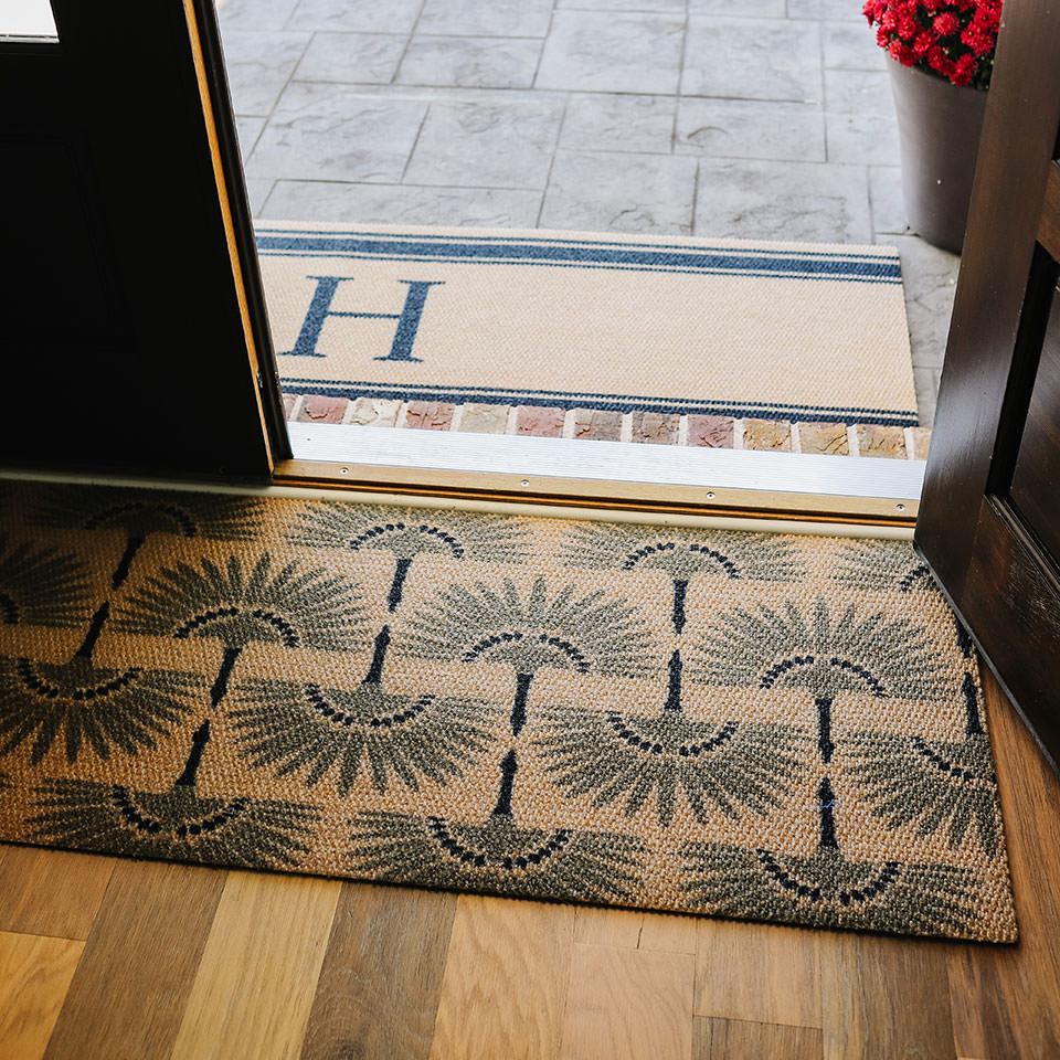 Tailfeathers double door mat in brown and army is a low profile mat that helps reduce the risk of slipping, tripping, and falling. It features a recycled surface made from recycled plastic and a recycled rubber backing.