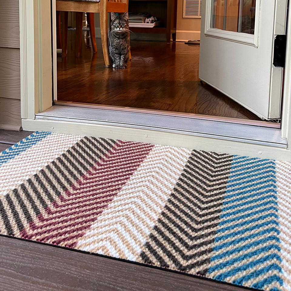 Textured Stripes single door doormat features red, brown, blue and white in a colorful pattern and is made with recycled materials. It's a door mat that will not shed or rot and will last for a very long time. Can be used indoors or outdoors if covered.