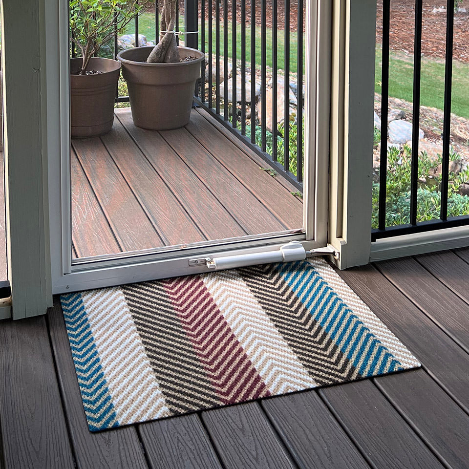Textured Stripes Multi single door doormat works great on a covered porch. It wipes the bottom of shoes clean from leaves, grass, sand, and dirt. Made in America.