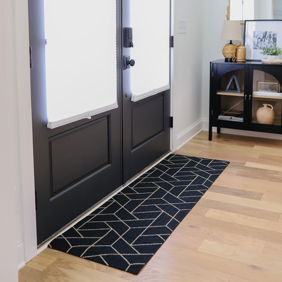 Triangulation double door doormat looks great in front of doors with windows. Made in America with recycled materials and will not shed or rot.